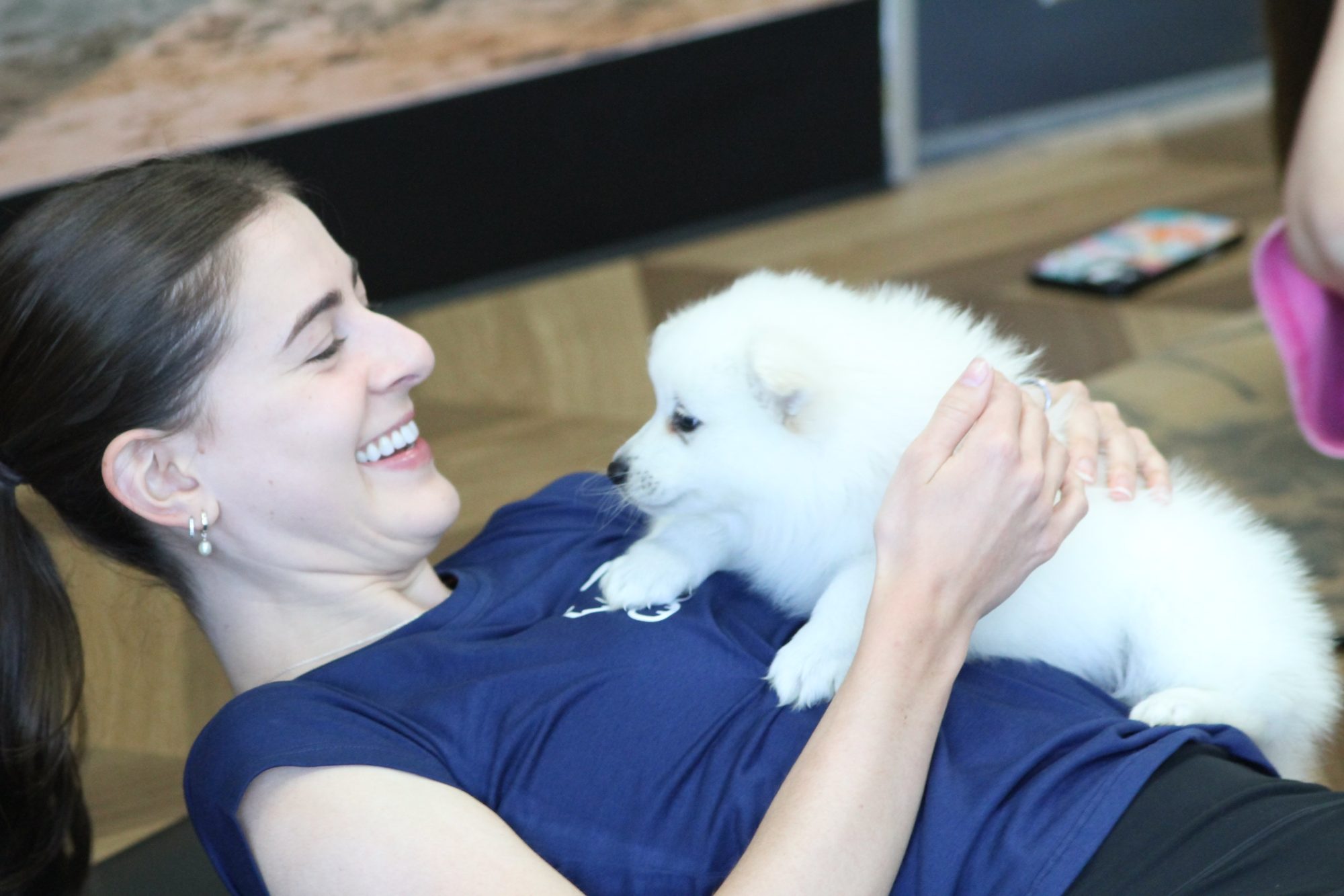 A guest cuddling a puppy